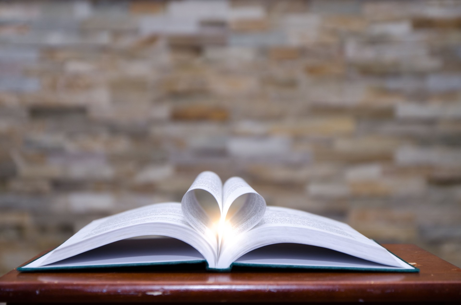 Open book with light glowing out of it